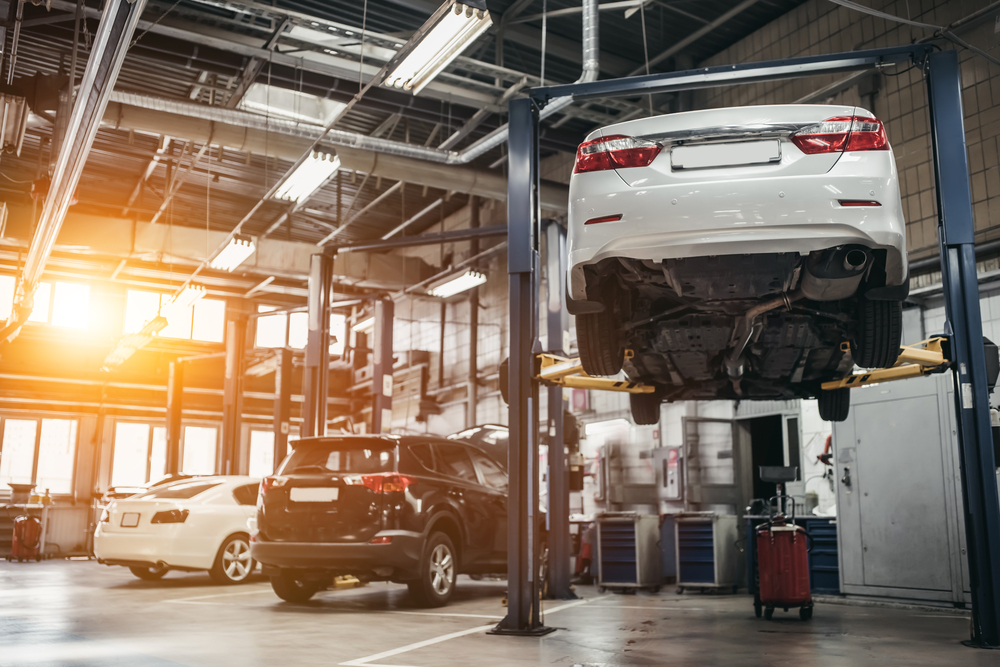 Car raised on car lift in autoservice