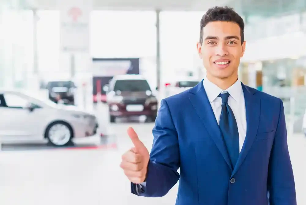 portrait-salesman-car-dealership-e1715084680337